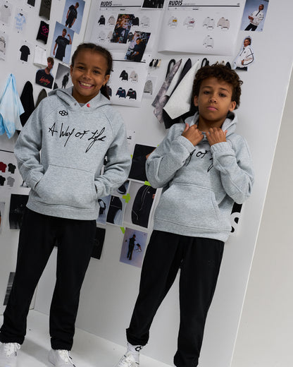 RUDIS A Way of Life Youth Tech Fleece Hoodie in Heather Gray, featuring black script chest graphics and RUDIS branding, styled with black athletic joggers.