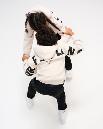 Overhead view of two youth athletes wearing RUDIS Wrestling Youth Relaxed Comfort Fleece Hoodies in Bone with contrasting black WRESTLING graphics across the back and sleeves.