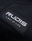 A close-up of a black fabric label featuring the brand name RUDIS and the tagline A WAY OF LIFE written in white