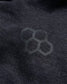 A close-up view of black fabric featuring a subtle hexagonal pattern highlighting texture and design details