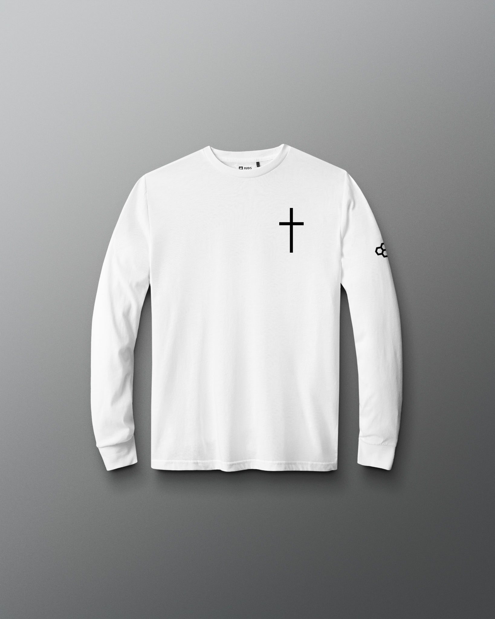 A white long-sleeve crewneck shirt with a black cross printed on the left chest and a small black logo on the right sleeve, displayed against a dark gray gradient background.