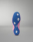Close-up of a pink and blue wrestling shoe sole on a gray background