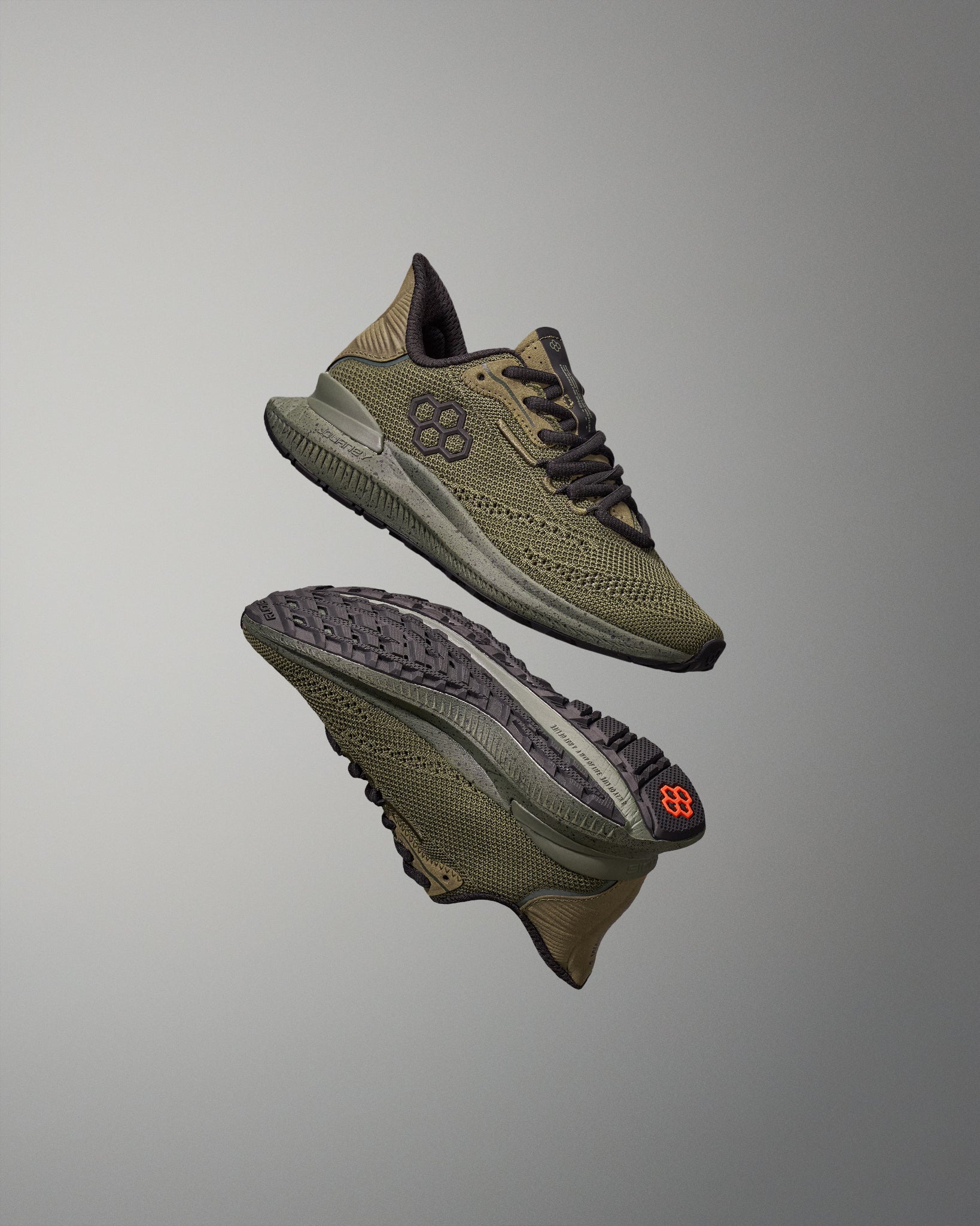 Pair of green training shoes on a gray background