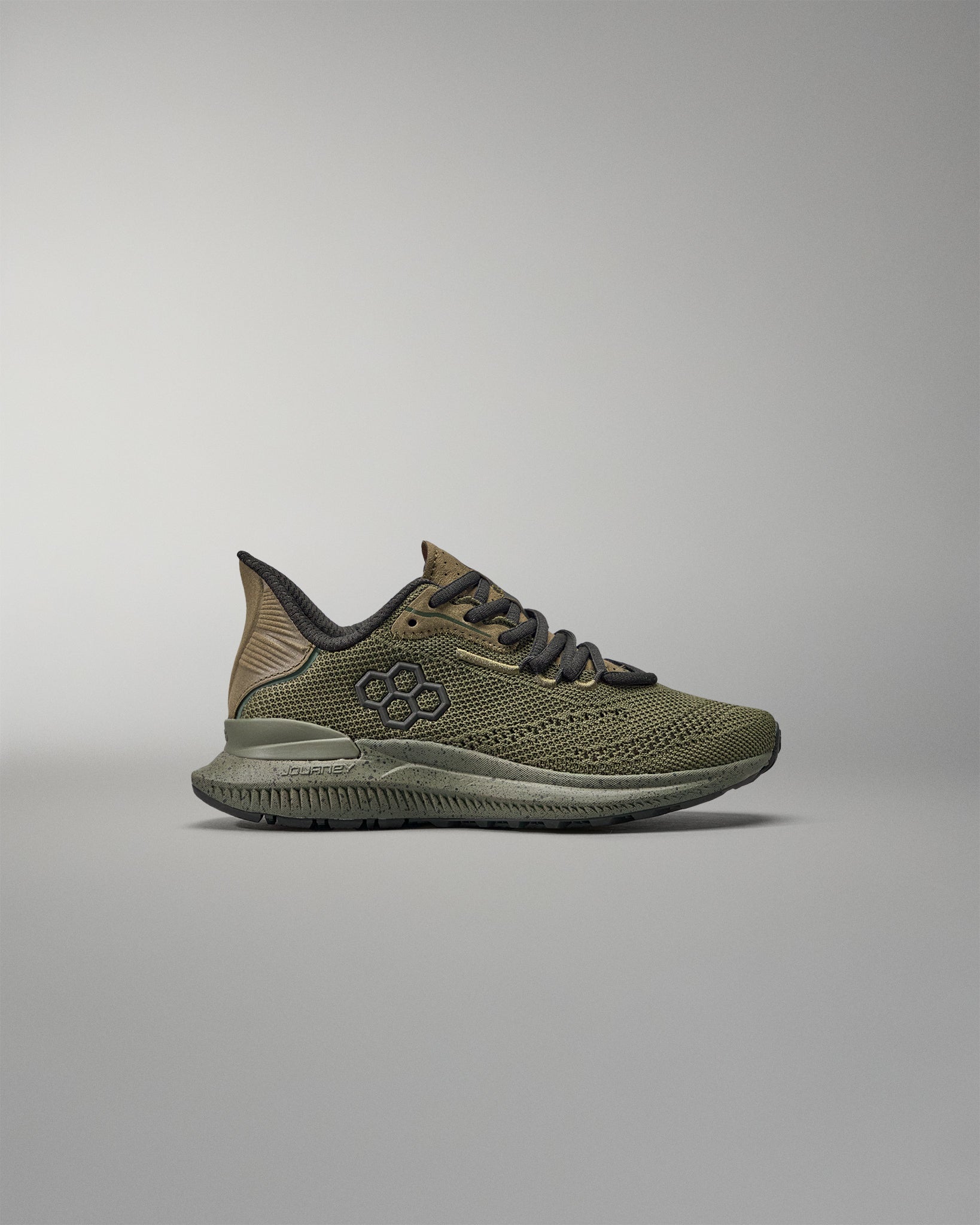 Green training shoes on a gray background