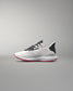 White running shoe with black and red accents on a gray background