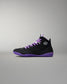 Black and purple sneaker with a brand logo on a gray background