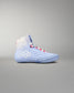 Blue wrestling shoe with white sole on a gray background