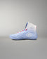 Blue wrestling shoe with a white logo on a gray background