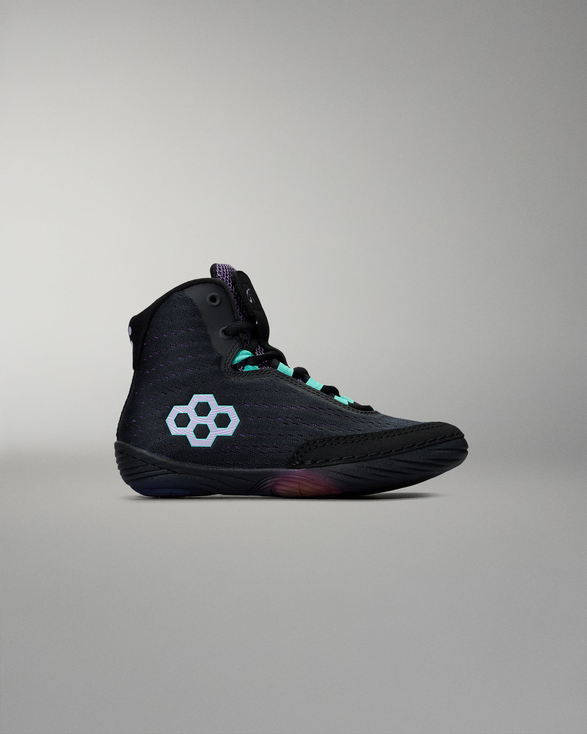 Black high-top sneaker with a white logo on a gray background