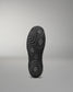 Black Wrestling Shoes sole with textured pattern on a gray background