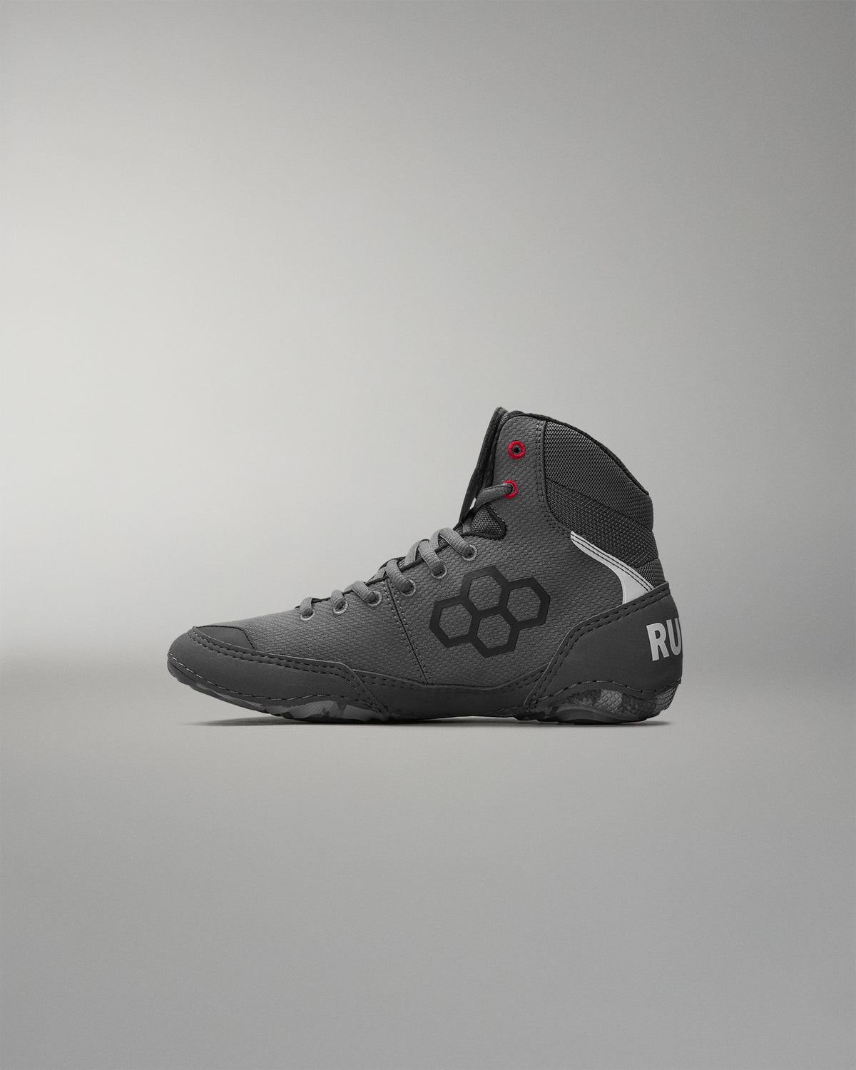 Gray wrestling shoe with 'RUDIS' brand logo on a gray background