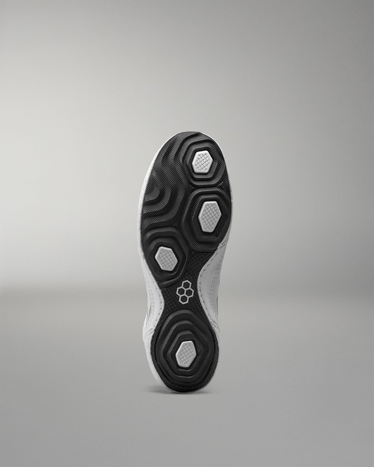 Close-up of a Wrestling Shoe sole with a brand logo on a gray background