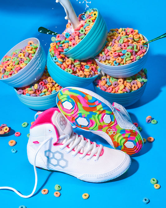 Colorful wrestling shoe with a cereal-themed design on a blue background