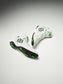 White wrestling shoes with black and green accents on a gray background