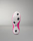 Sole of a pink and white athletic shoe on a gray background