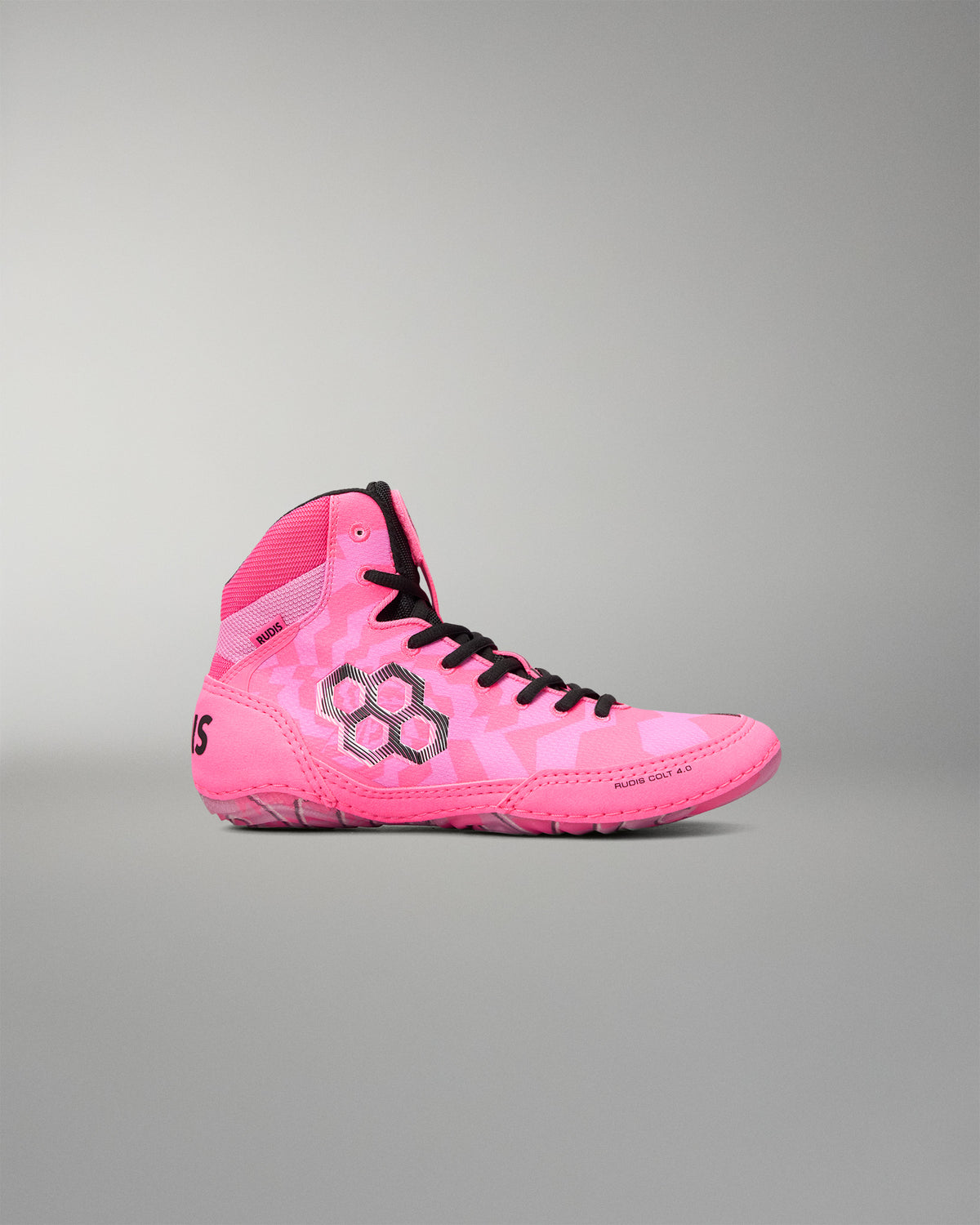 A single high-top Wrestling shoe in vibrant pink with a subtle tonal geometric pattern, black laces, and a black hexagonal logo on the side, set against a solid gray background.