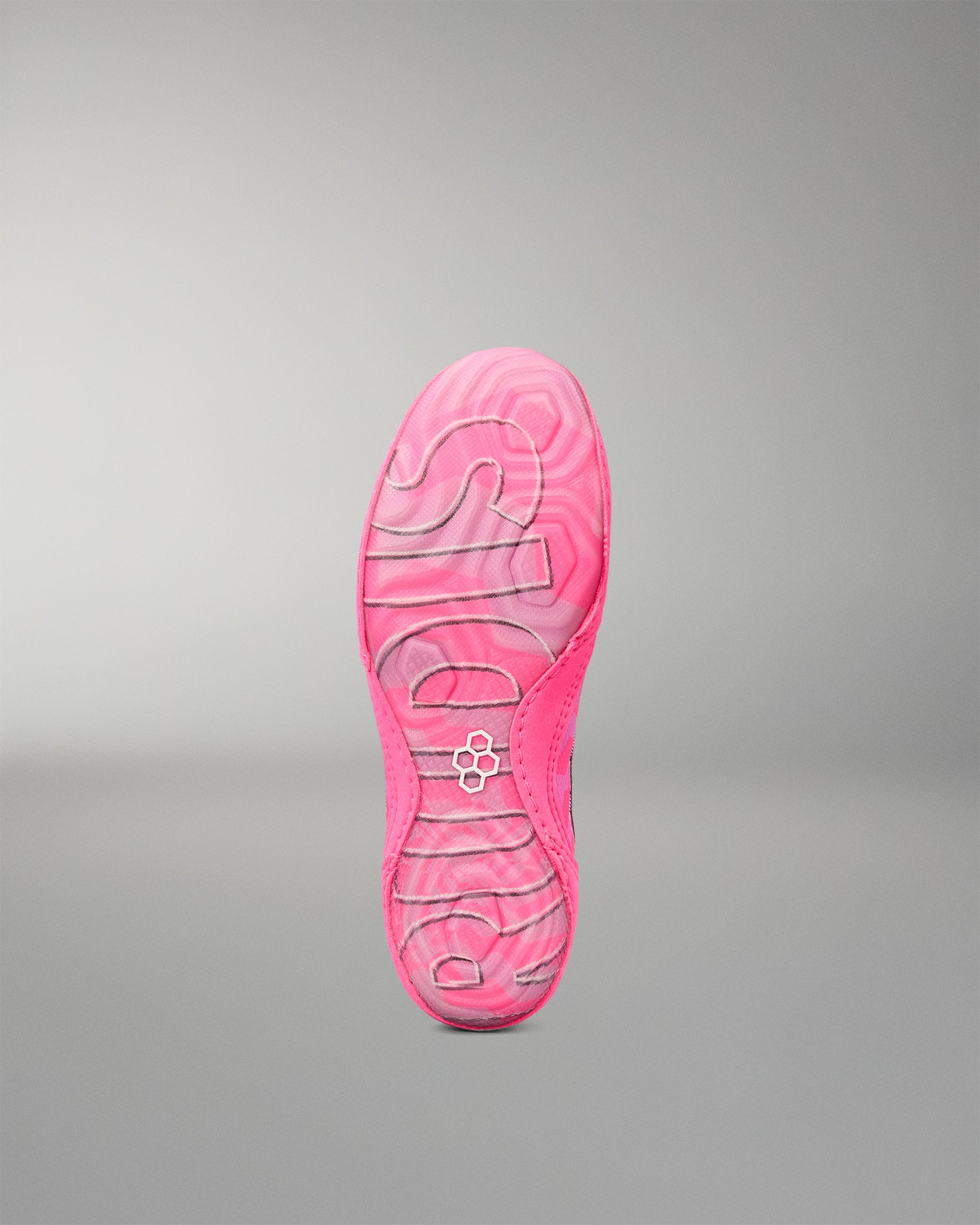 A bright pink Wrestling shoe sole with the brand name 'RUDIS' and a small circular logo embossed in the center, shown against a neutral gray gradient background.