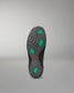 Sole of a wrestling shoe with green hexagonal patterns on a gray background