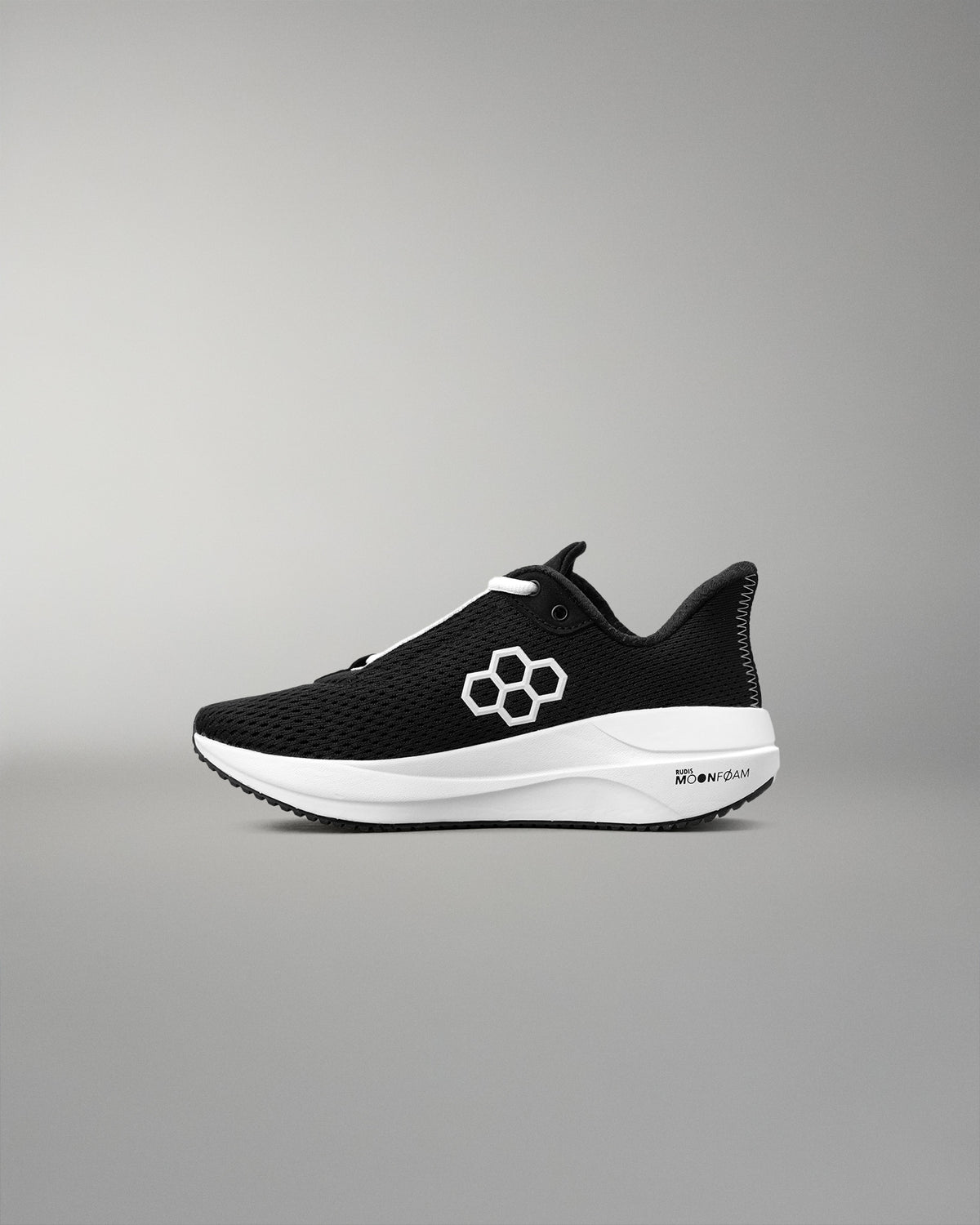Black and white running shoe on a gray background