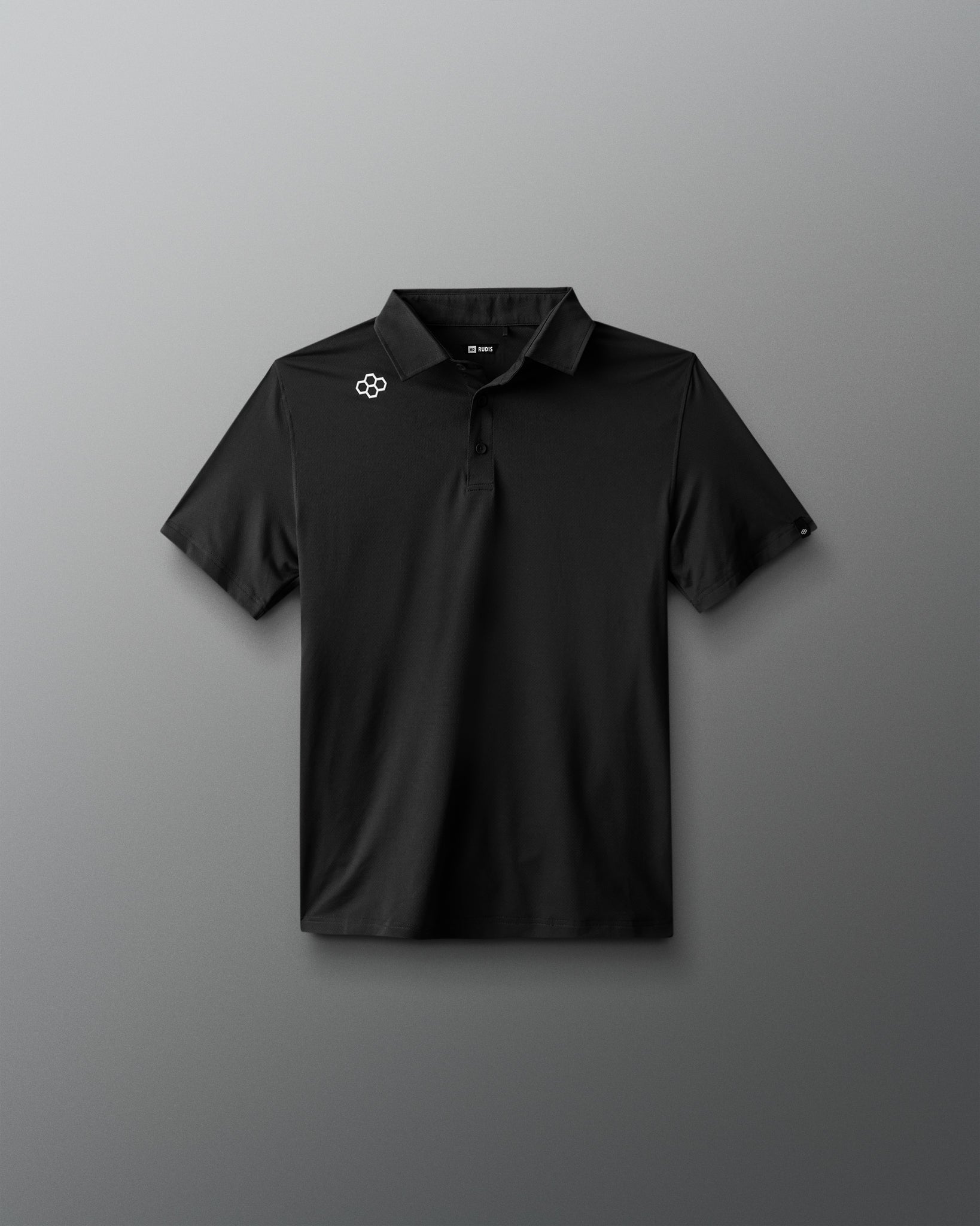 Black polo shirt with a logo on a gray background