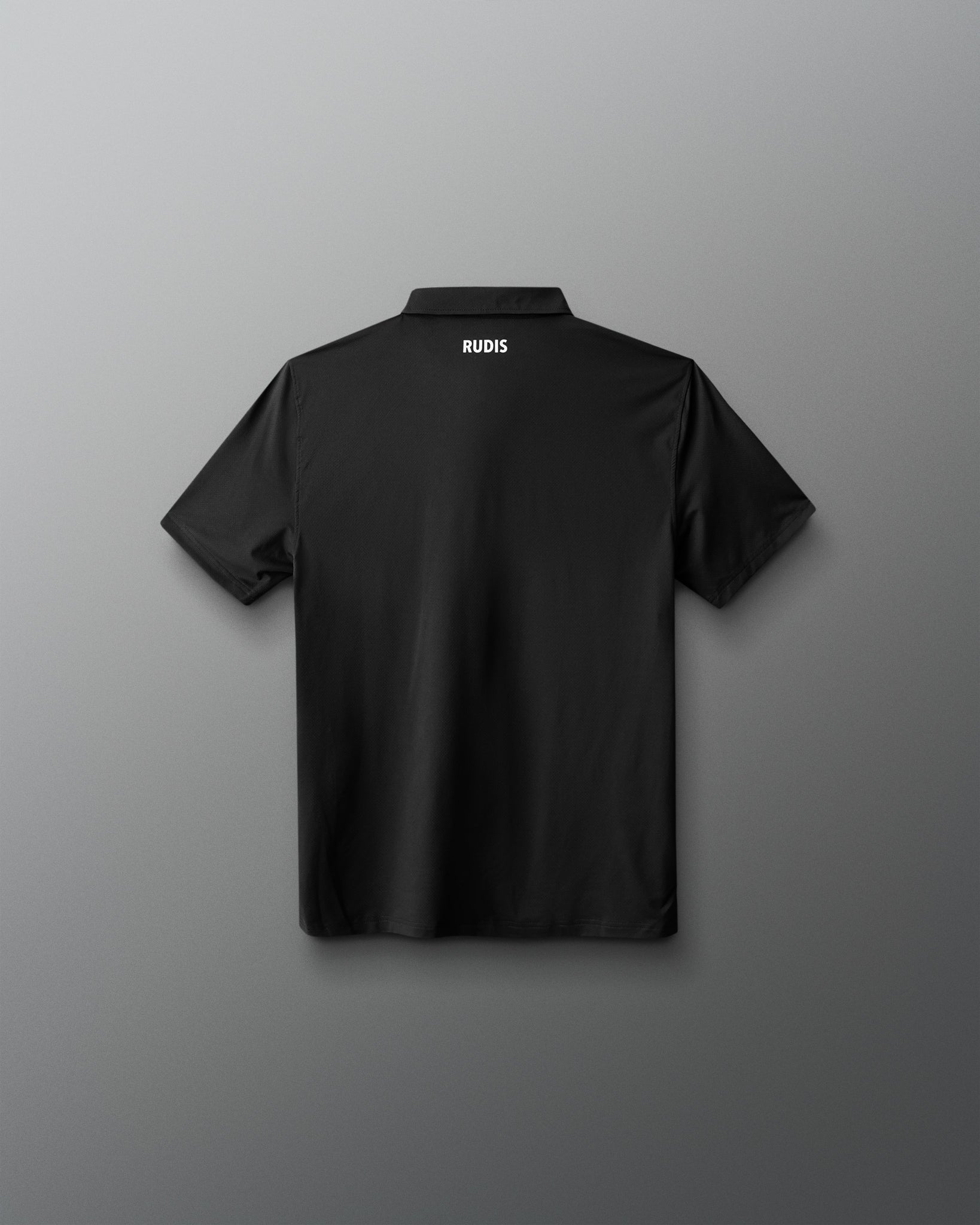 Black polo shirt with 'RUDIS' logo on the back against a gray background