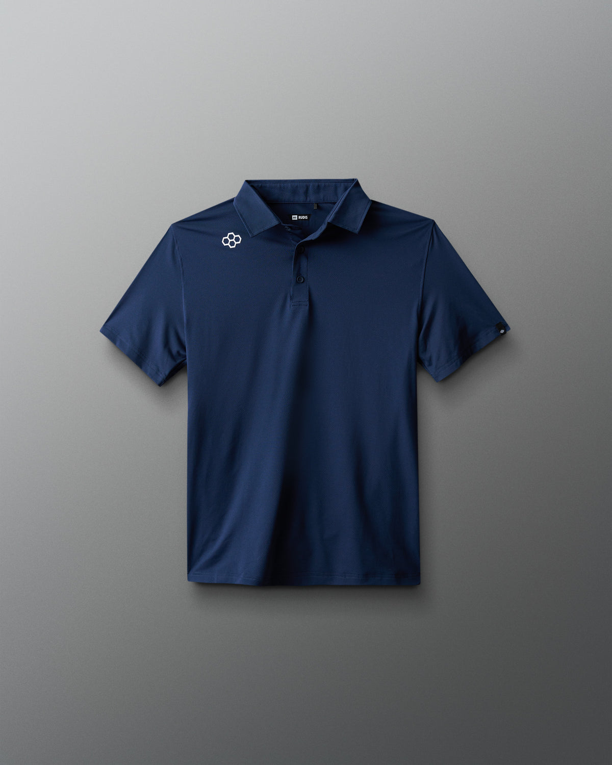 Navy blue polo shirt with a logo on a gray background