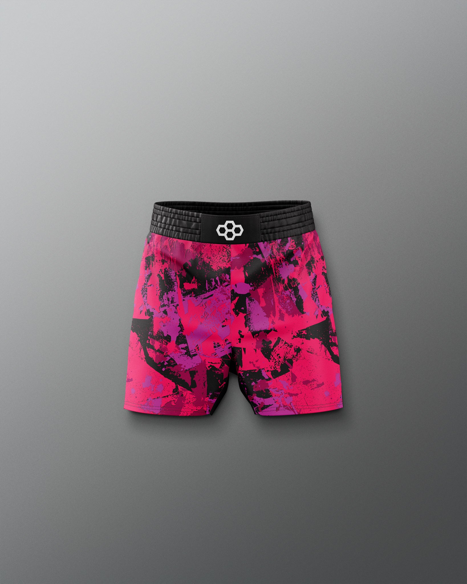 Pink and black patterned shorts on a gray background