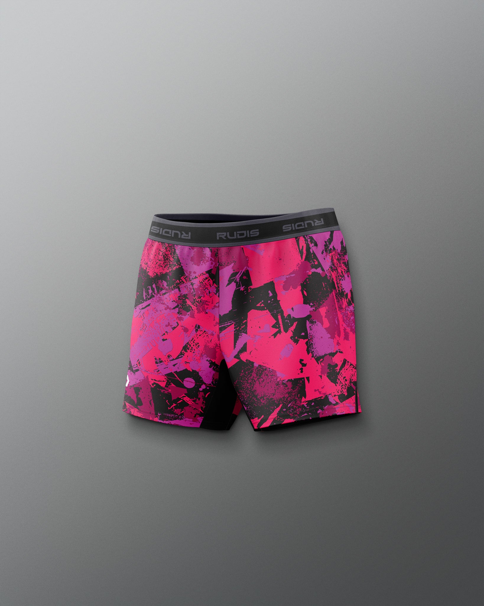 Pink and black patterned shorts on a gray background