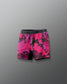 Pink and black patterned shorts on a gray background