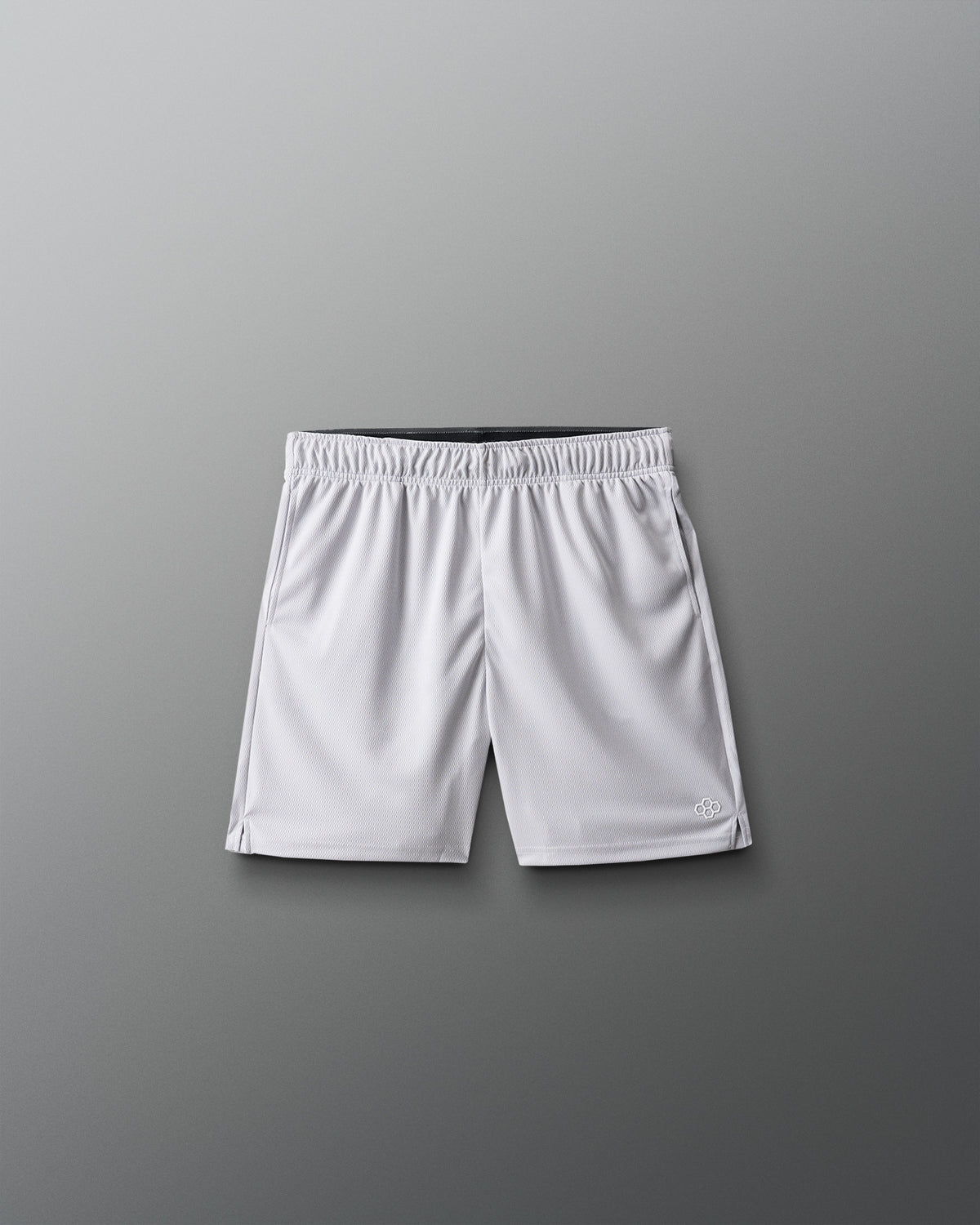 White athletic shorts on a gray background