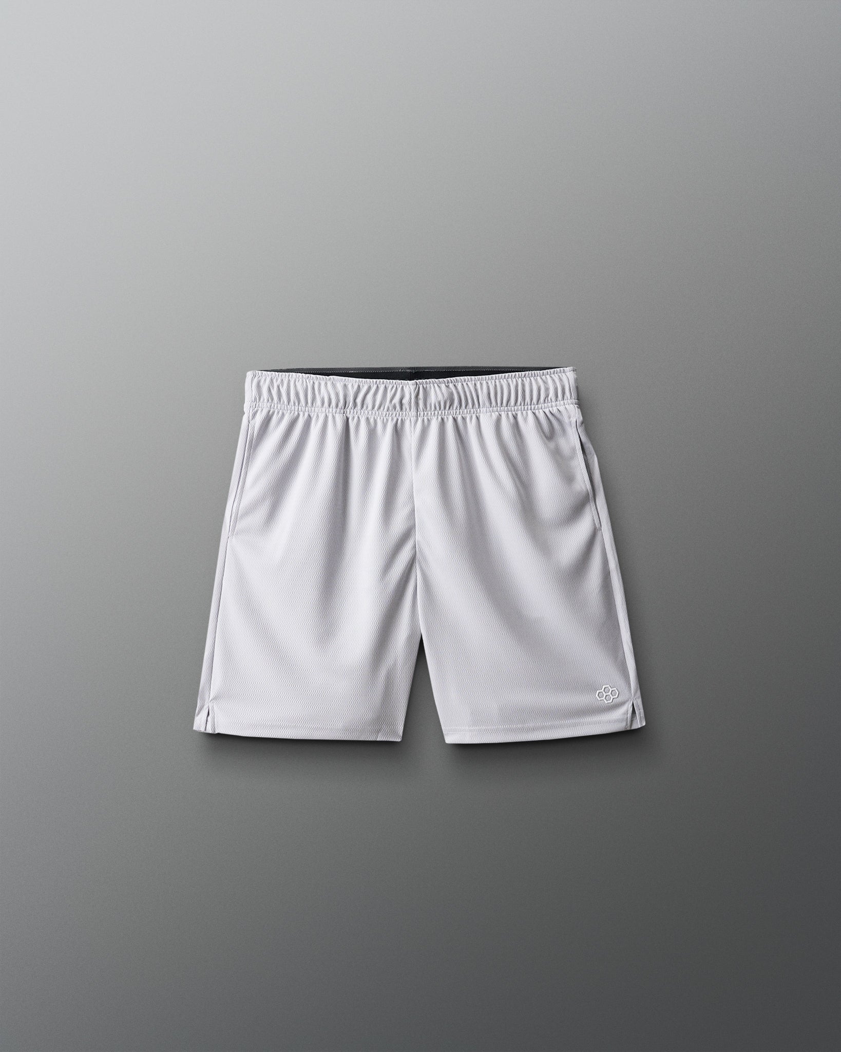 White athletic shorts on a gray background