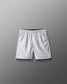 White athletic shorts on a gray background