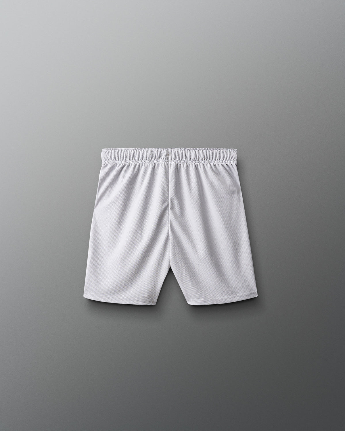 White athletic shorts on a gray background