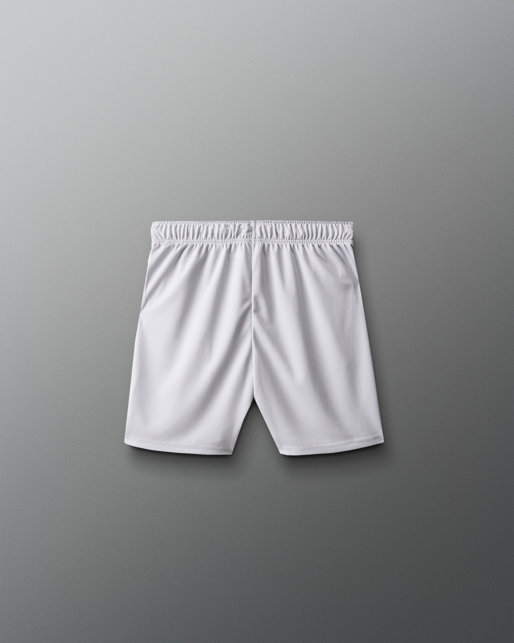 White athletic shorts on a gray background