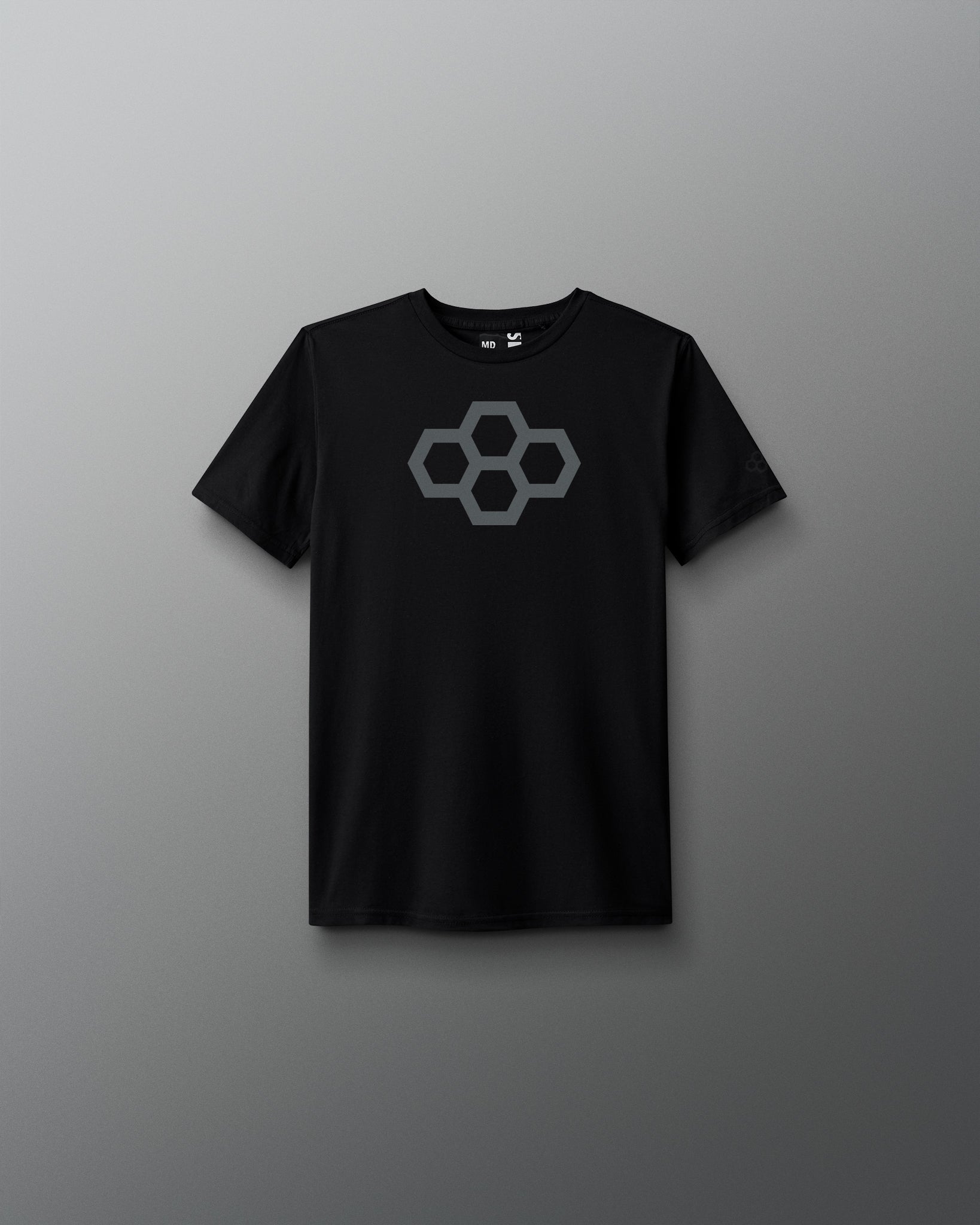 A black youth-sized t-shirt with a white graphic quadhex design on the front.