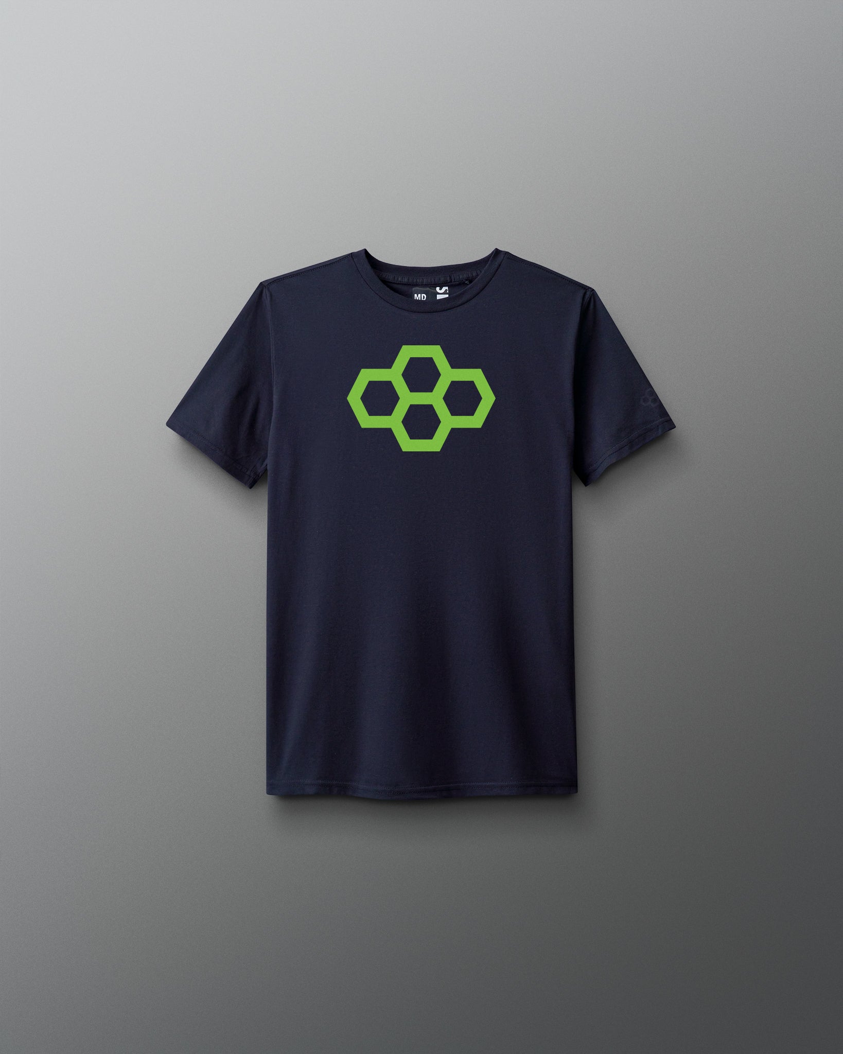 A youth-sized navy t-shirt with a green graphic of a quadhex in the center.