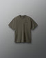 Green t-shirt with a small logo on a gray background