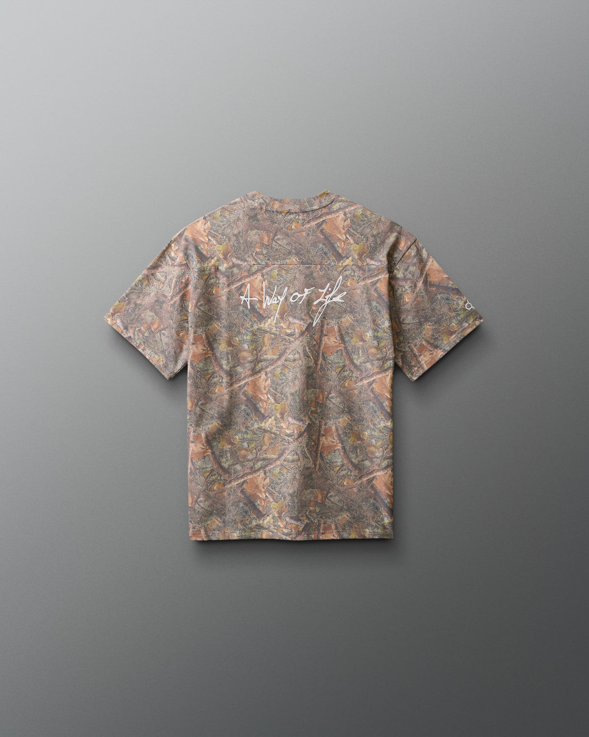 Camouflage-patterned t-shirt on a gray background