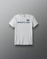 White t-shirt with 'Wrestling' text and American flag on a gray background