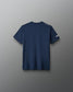 Navy t-shirt with brand logo on a gray background