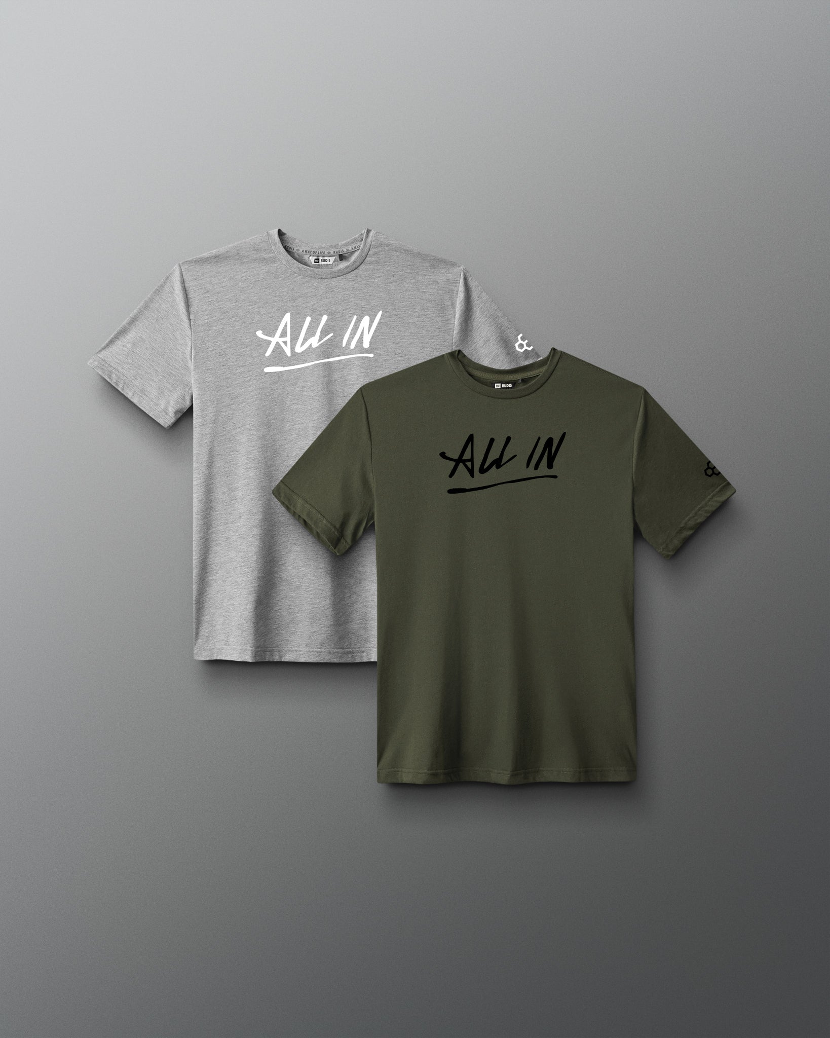 Front view of the RUDIS Motto Scripted Youth Elite Super Soft T-Shirt 2-Pack in olive and heather gray featuring “All In” chest graphics.