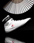 White wrestling shoe with 'All In' branding on a black background