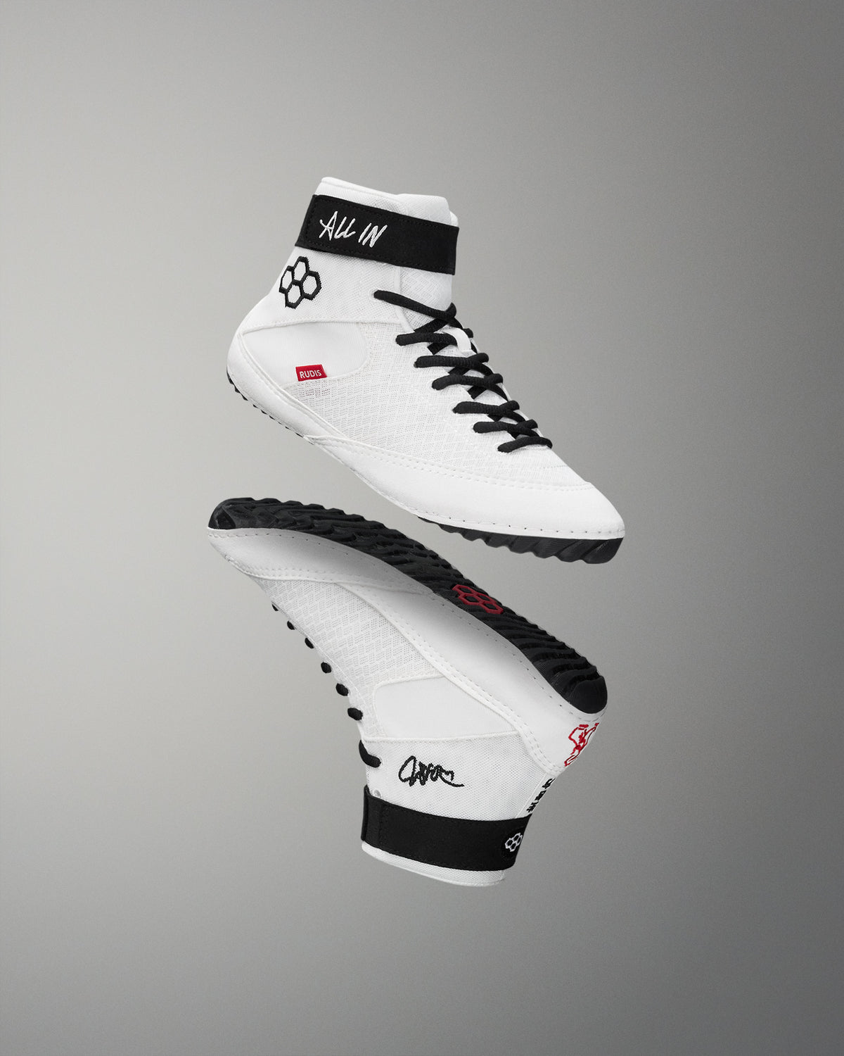 White wrestling shoes with black accents on a gray background