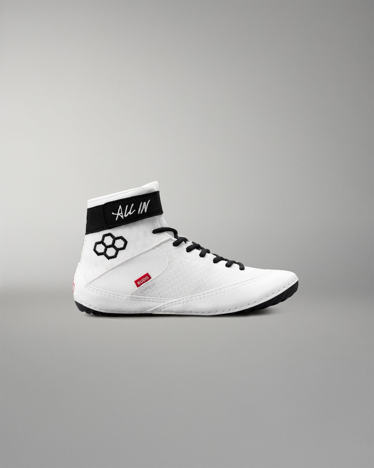 White wrestling shoe with black accents on a gray background