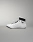 White wrestling shoe with black accents on a gray background