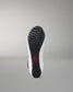 Sole of a wrestling shoe with a red logo on a gray background