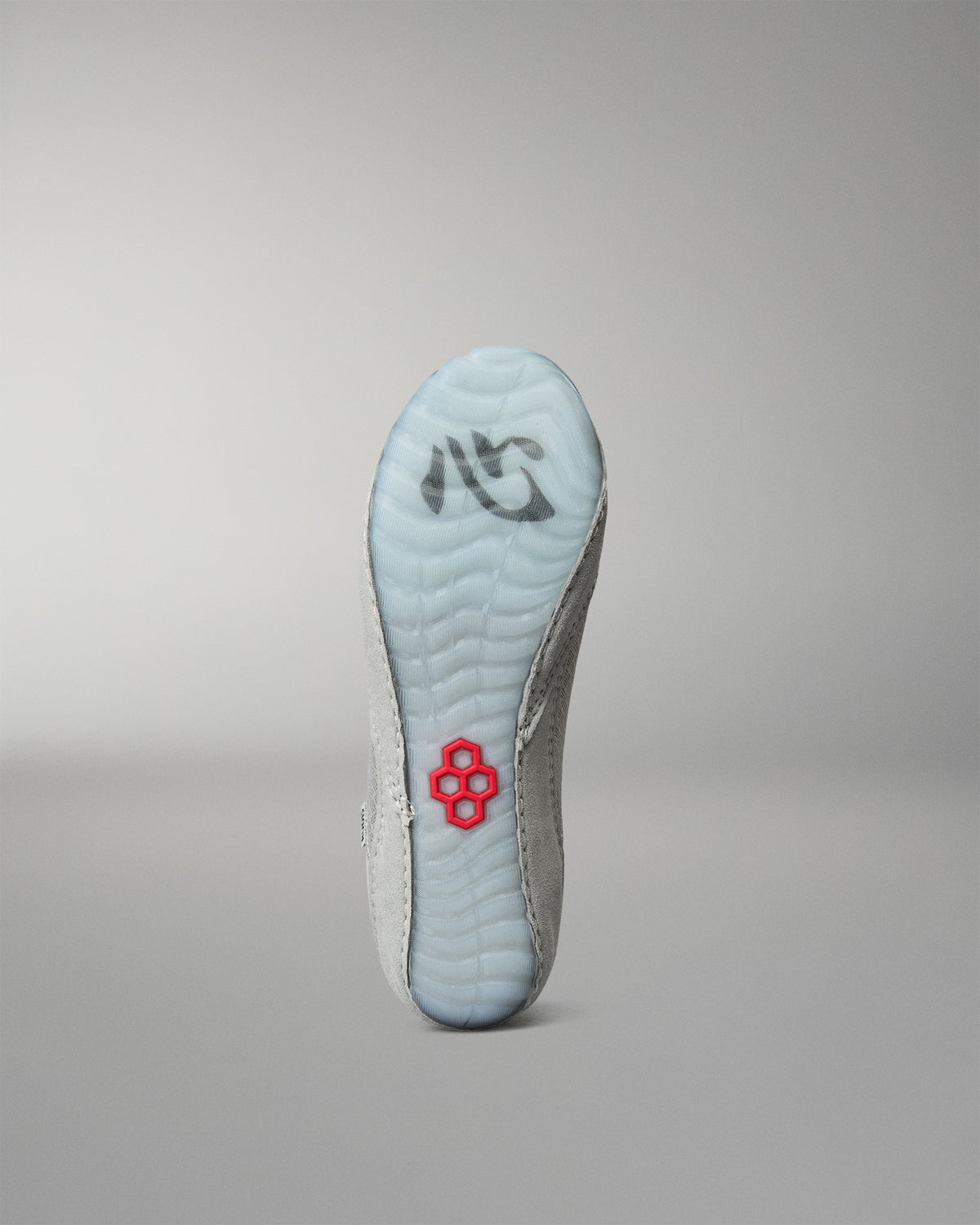 Outsole view of the RUDIS Samurai Speed Youth Kokoro wrestling shoe, featuring translucent light blue rubber, a textured traction pattern, and red RUDIS emblem.
