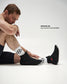 Spencer Lee, 2026 World Team Member, seated in RUDIS Samurai Speed Wabi-Sabi wrestling shoes featuring black mesh uppers, ankle straps, and red accents.