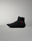 Inner side view of the RUDIS Samurai Speed Youth Wabi-Sabi wrestling shoe, showing black mesh construction, red embroidered signature, ankle strap, and translucent sole.