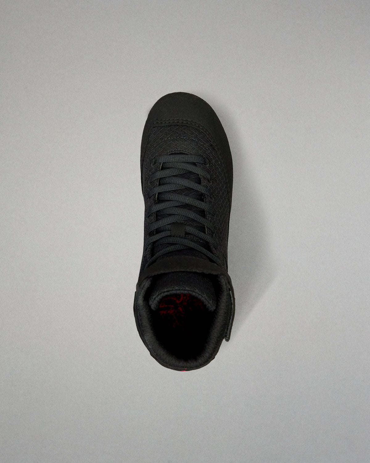 Top-down view of the RUDIS Samurai Speed Youth Wabi-Sabi wrestling shoe in black, showing its lace-up design, textured mesh upper, rounded toe, and padded ankle opening.